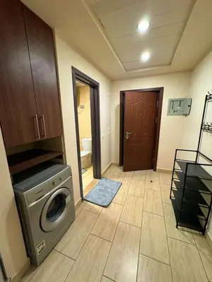 a laundry room with a washing machine in it at Coral Aldau Heights one bedroom apartment in hurghada in Hurghada
