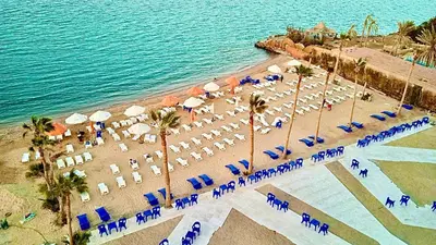an aerial view of a beach with chairs and umbrellas at B1-04 Juliana in Hurghada