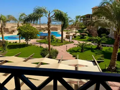a view of a resort with a pool and palm trees at Al Saraya Sahl Hasheesh by Peaks One Bedroom Apartment with Pool View C201 in Hurghada