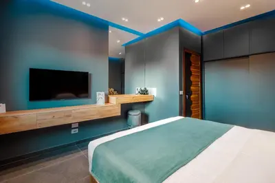 a bedroom with a large bed and a flat screen tv at Al Saraya Sahl Hasheesh by Peaks One Bedroom Apartment with Pool View C201 in Hurghada