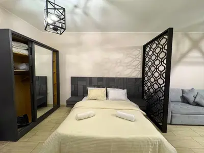 a bedroom with a bed with two pillows on it at Aldau Heights studio in Hurghada gol in Hurghada