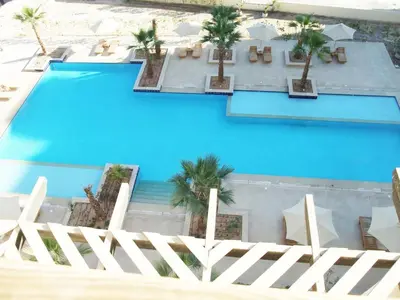 an overhead view of a swimming pool with palm trees at Aldau Heights studio in Hurghada gol in Hurghada
