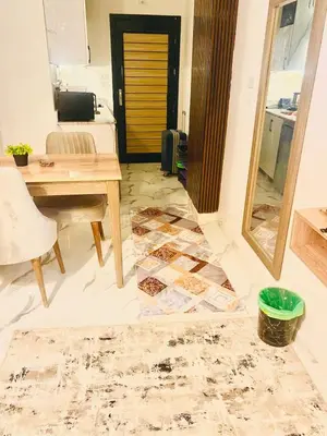a living room under construction with a tile floor at The Modern Nest Magawish in Hurghada