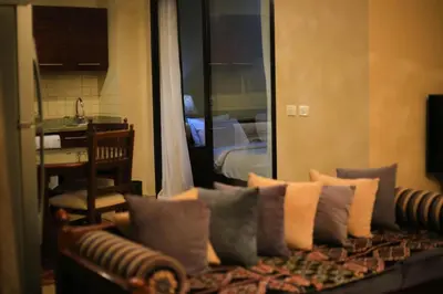 a couch with pillows on it in a room at Port ghalib in Abu Dabab