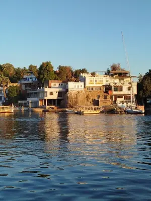 a group of houses on the banks of a river at Anno ka in Jazīrat Aswān