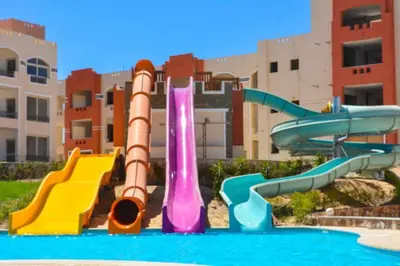 a water park with a water slide in a pool at Oysterbay in Marsa Alam