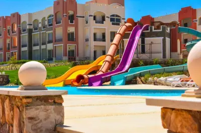 a playground at a resort with a slide at Oysterbay in Marsa Alam