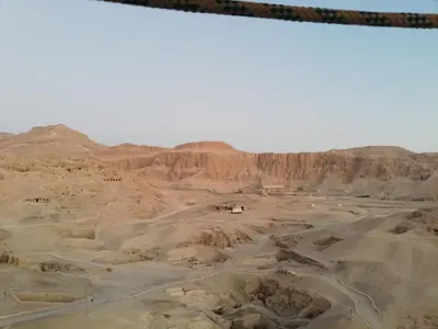 a view of the desert with a house in the middle at House of peace in Al Aqālitah