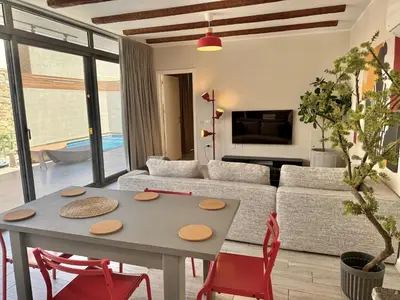 a living room with a table and chairs and a couch at Modern 2BR Villa With Private Pool In Bali In ElGouna in Hurghada