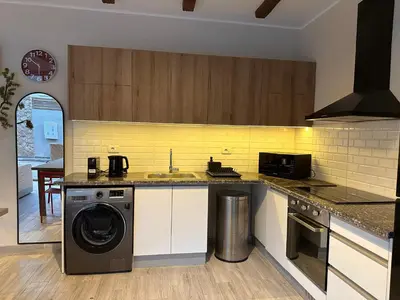 a kitchen with a washing machine and a sink at Modern 2BR Villa With Private Pool In Bali In ElGouna in Hurghada