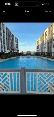 a view of a pool from a balcony of a building at Luxus Apartment in Hurghada