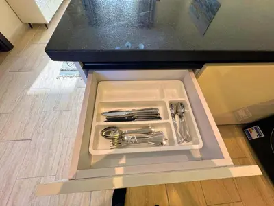 a drawer in a counter with utensils in it at Beauty Aldau heights in Hurghada