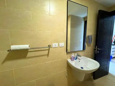 a bathroom with a sink and a mirror at Beauty Aldau heights in Hurghada