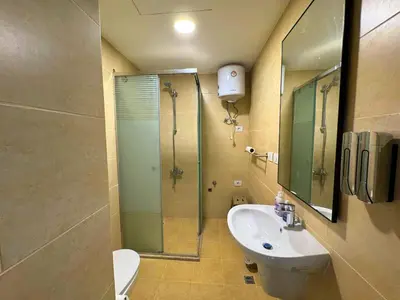 a bathroom with a shower and a sink and a toilet at Diamond Aldau in Hurghada