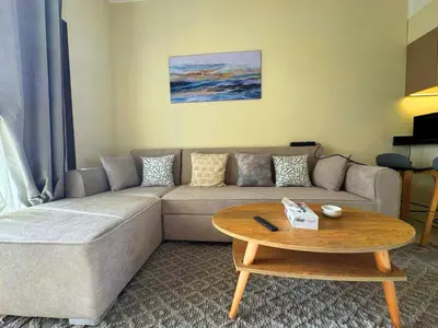 a living room with a couch and a coffee table at Diamond Aldau in Hurghada