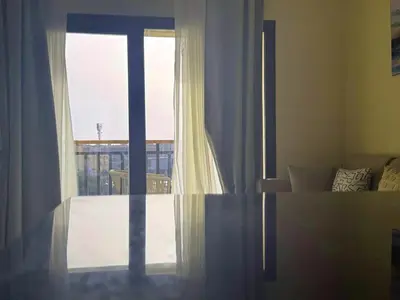 a room with a window with a view of a balcony at Diamond Aldau in Hurghada