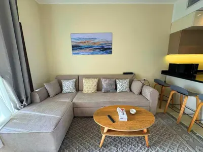 a living room with a couch and a table at Diamond Aldau in Hurghada