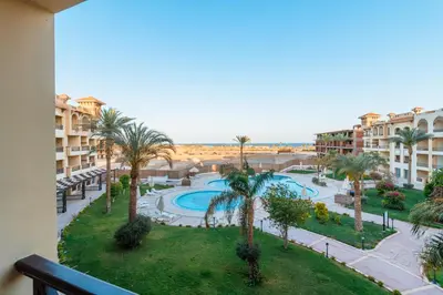a view of a resort with a pool and palm trees at Al Saraya Sahl Hasheesh by Peaks One Bedroom Apartment With Pool View C304 in Hurghada