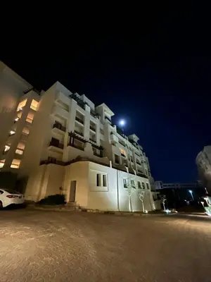 a large building with a light on top of it at 1-Bedroom Aldau Heights in Hurghada