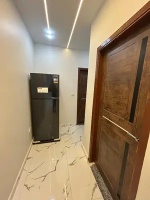 a door to a room with a tile floor and a door at Two Bedroom Apartment in Hurghada