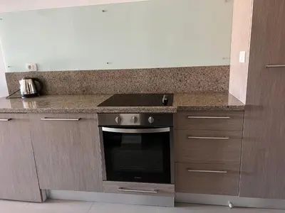a kitchen with a stove and a counter top at Luxury Studio in Aldau Heights Hurghada in Hurghada
