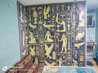 a room with a wall with a painting on it at Centre point Aswan in Aswan