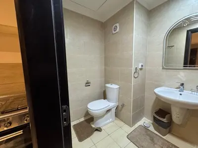 a bathroom with a toilet and a sink at Sun & Fun Aldau Heights one bedroom apartment in hurghada in Hurghada