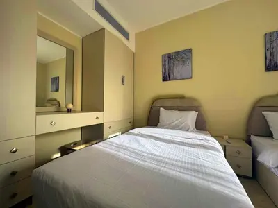 a bedroom with a white bed and a mirror at Aldau Heights one bedroom apartment in Hurghada cr in Hurghada
