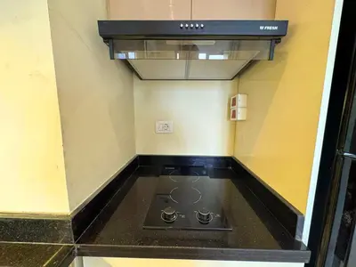 a kitchen with a stove top oven in a room at Aldau Heights one bedroom apartment in Hurghada cr in Hurghada