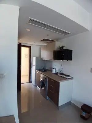 a kitchen with a washer and dryer in a room at Gcribs B7F7 in El Gouna