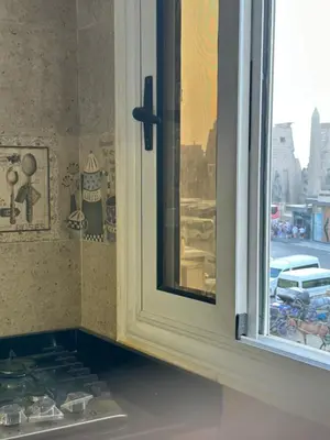 a window in a kitchen next to a stove at Temple & Nile view in Luxor