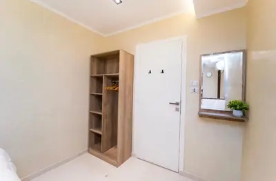 a room with a white door and a mirror at Temple & Nile view in Luxor