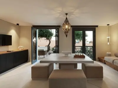 a living room with a table and a couch at The Chedi El Gouna in Hurghada