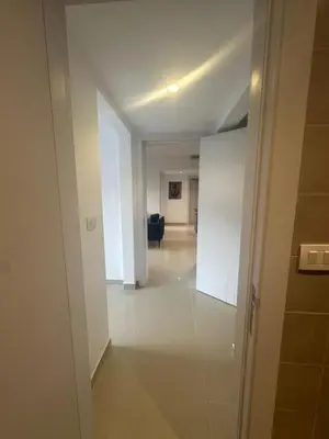 an empty hallway with a living room in a building at Hotel apartment in G cribs 2BR in El Gouna