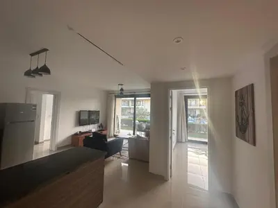 a living room with a couch and a living room with at Hotel apartment in G cribs 2BR in El Gouna