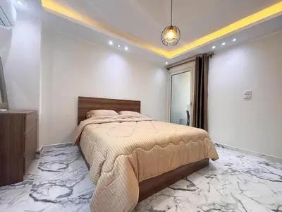 a bedroom with a large bed in a room at 2 bedrooms in Hurghada Hub Resort in Hurghada