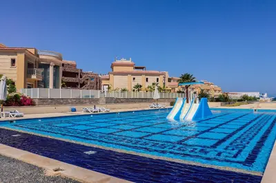 a swimming pool with slides in the water at Selena Bay Resort in Hurghada