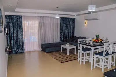 a living room with a couch and a table at Selena Bay Resort in Hurghada