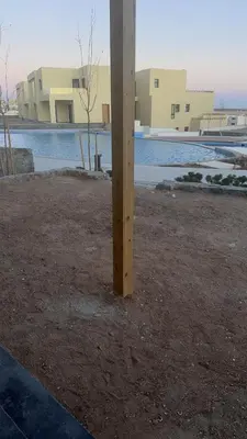 a wooden pole in the middle of a field at Luxury 3BD Makadi Heights phase 2 Orascom in Hurghada
