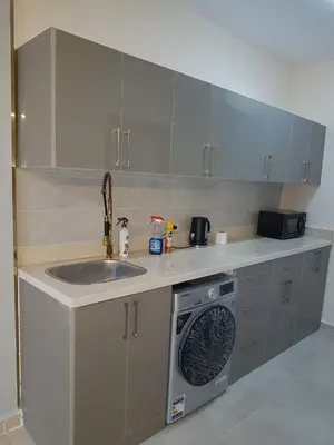a kitchen with a sink and a washing machine at Taiba Golden Resort in Hurghada