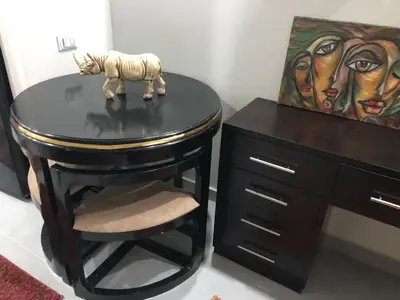 a table with a toy zebra on it next to a desk at scandic Resort hurghada in Hurghada
