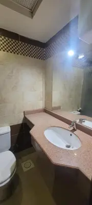 a bathroom with a white toilet and a sink at Apartment With Free Private Beach Furnished Near senzomall in Hurghada