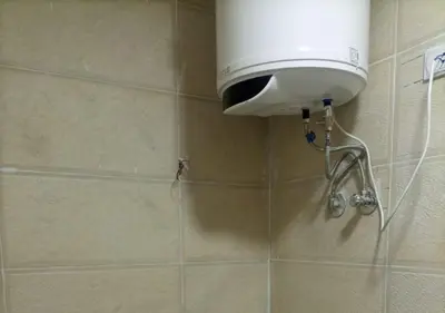 a shower with a water tank on a tiled wall at -Hurghada HUB Resort-Peaceful Getaway in Hurghada