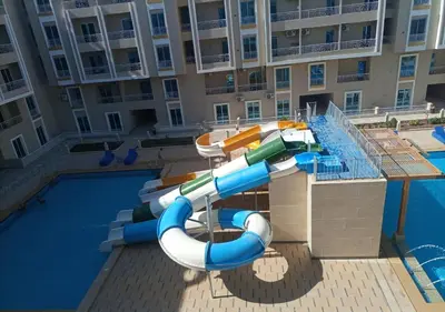 a water slide in a pool at a resort at -Hurghada HUB Resort-Peaceful Getaway in Hurghada