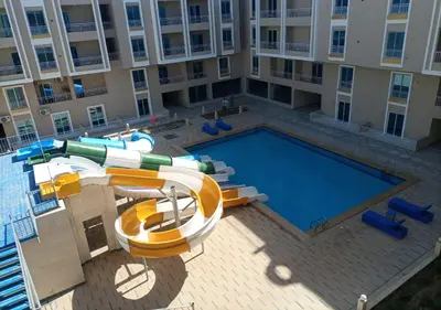 an overhead view of a swimming pool in front of a building at -Hurghada HUB Resort-Peaceful Getaway in Hurghada