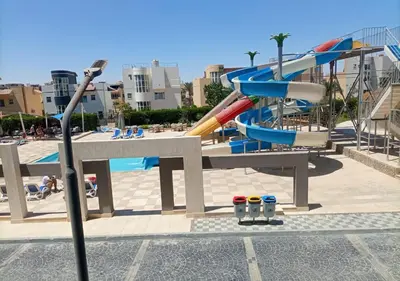 a water park with a slide and a pool at Fanadir Bay - beach & Aquapark in Hurghada