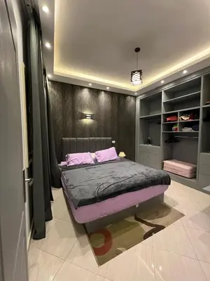 a bedroom with a bed in a room at Sunflower cozy apartment in Hurghada