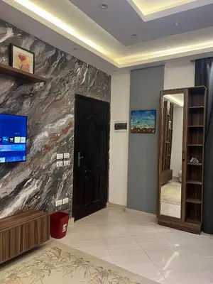a room with a door and a painting on the wall at Sunflower cozy apartment in Hurghada