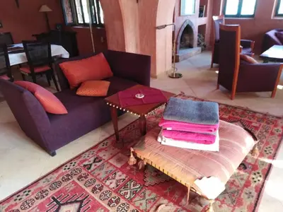 a living room with a couch and a table at فيلا نوبيا بجوار بيتش الزيتونه in Hurghada