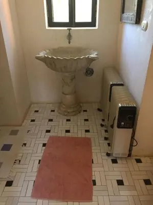 a bathroom with a sink and a window at فيلا نوبيا بجوار بيتش الزيتونه in Hurghada
